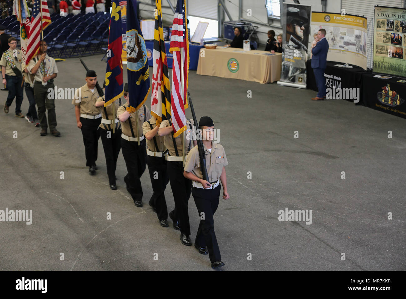 The Annapolis High School NJROTC march down the aisle for the recession ...