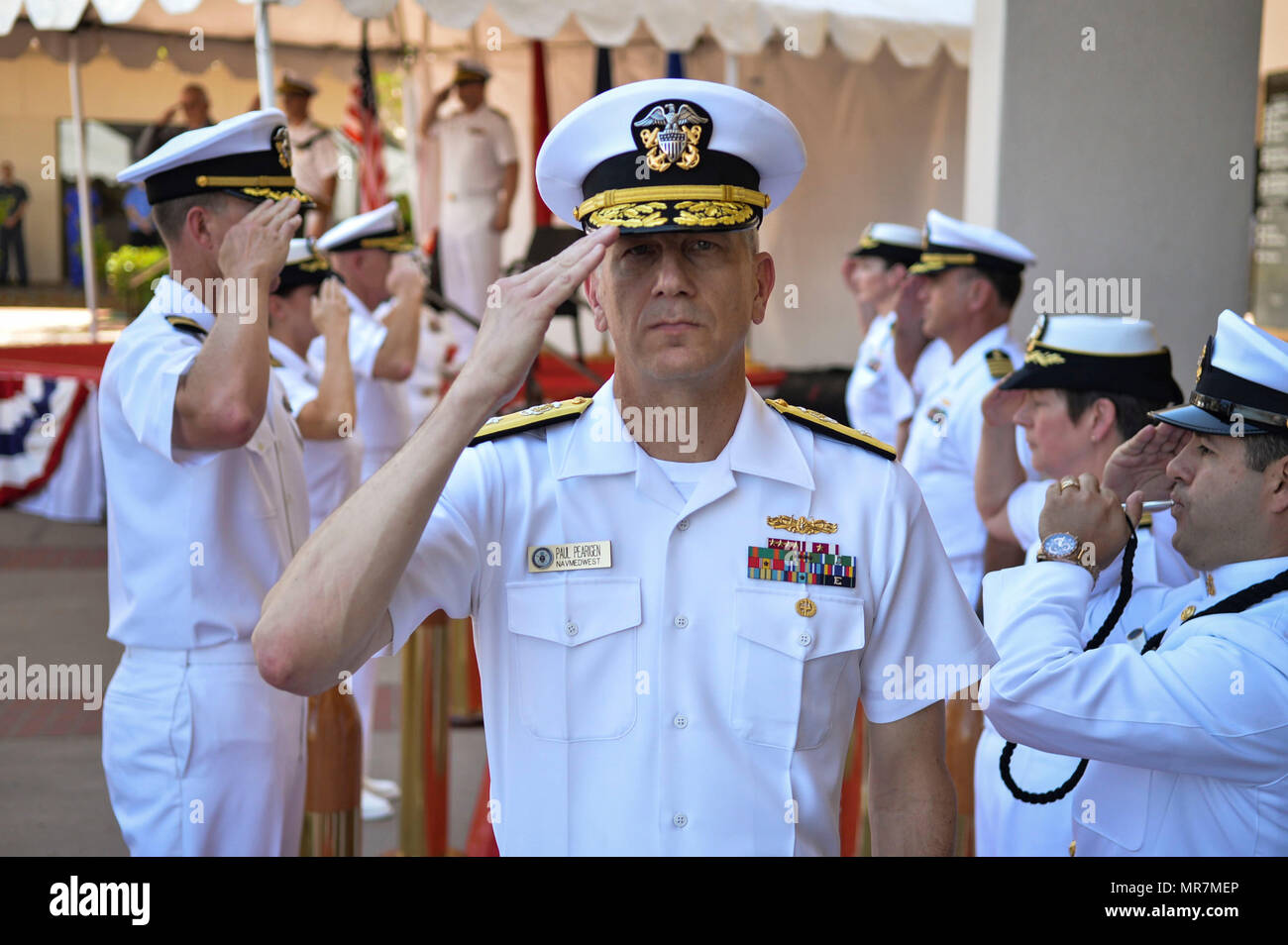 170517-N-IW246-401 SAN DIEGO (May 19, 2017) Rear Adm. Paul D. Pearigen, Commander, Navy Medicine West and chief of the Navy Medical Corps, is rendered honors at the end of a centennial ceremony at Naval Medical Center San Diego (NMCSD). The ceremony was held to celebrate NMCSD’s 100th birthday. The Navy’s first permanent medical facility in San Diego was established in Balboa Park on May 20, 1917 (Photo by Culinary Specialist Petty Officer 2nd Class Luther C. Smith Jr./Released) Stock Photo