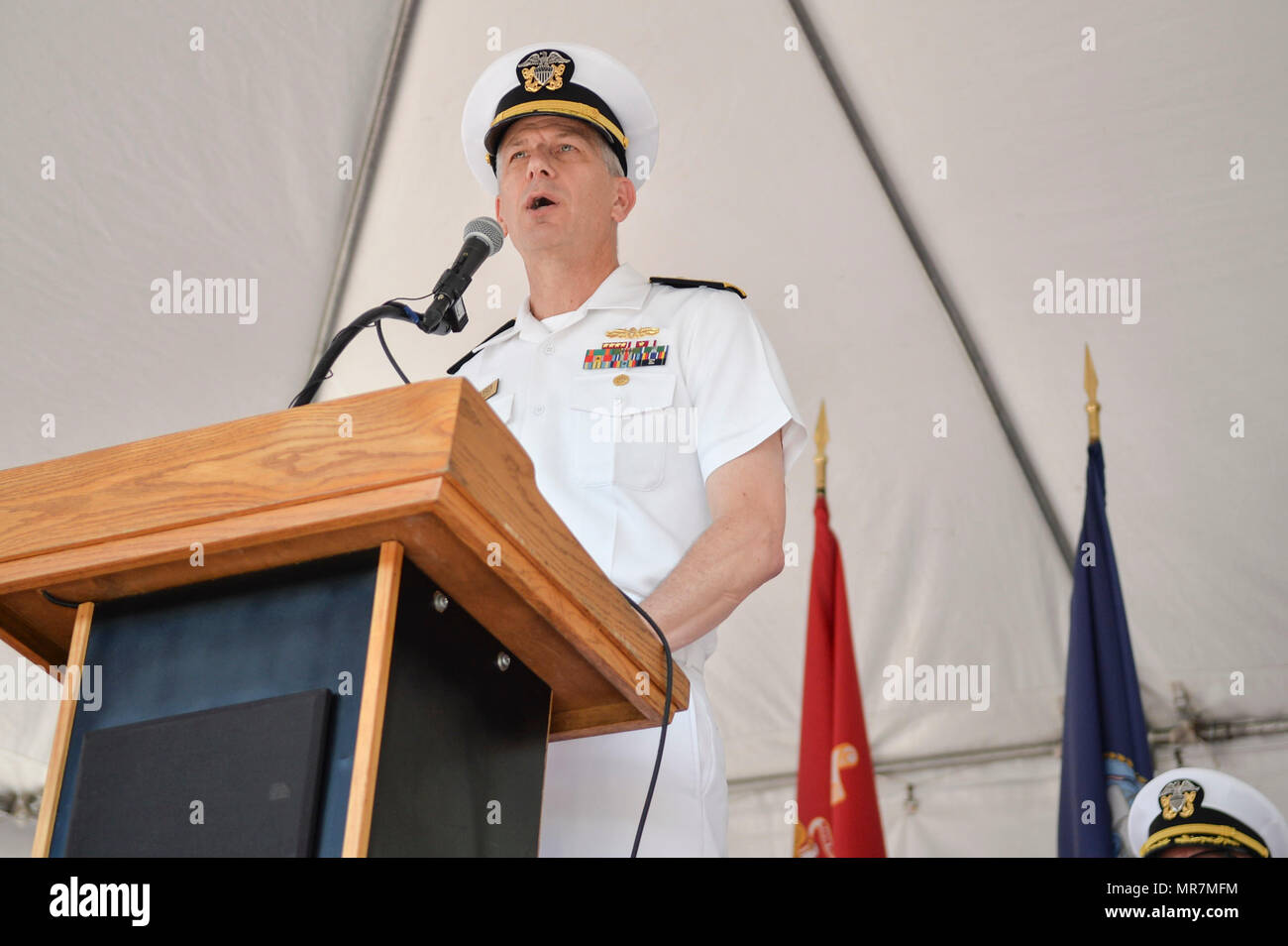 170517-N-IW246-122 SAN DIEGO (May 19, 2017) Rear Adm. Paul D. Pearigen, Commander, Navy Medicine West and chief of the Navy Medical Corps, speaks on the progress and growth of Naval Medical Center San Diego (NMCSD) at NMCSD’s centennial ceremony. The ceremony was held to celebrate NMCSD’s 100th birthday. The Navy’s first permanent medical facility in San Diego was established in Balboa Park on May 20, 1917. (Photo by Culinary Specialist Petty Officer 2nd Class Luther C. Smith Jr./Released) Stock Photo