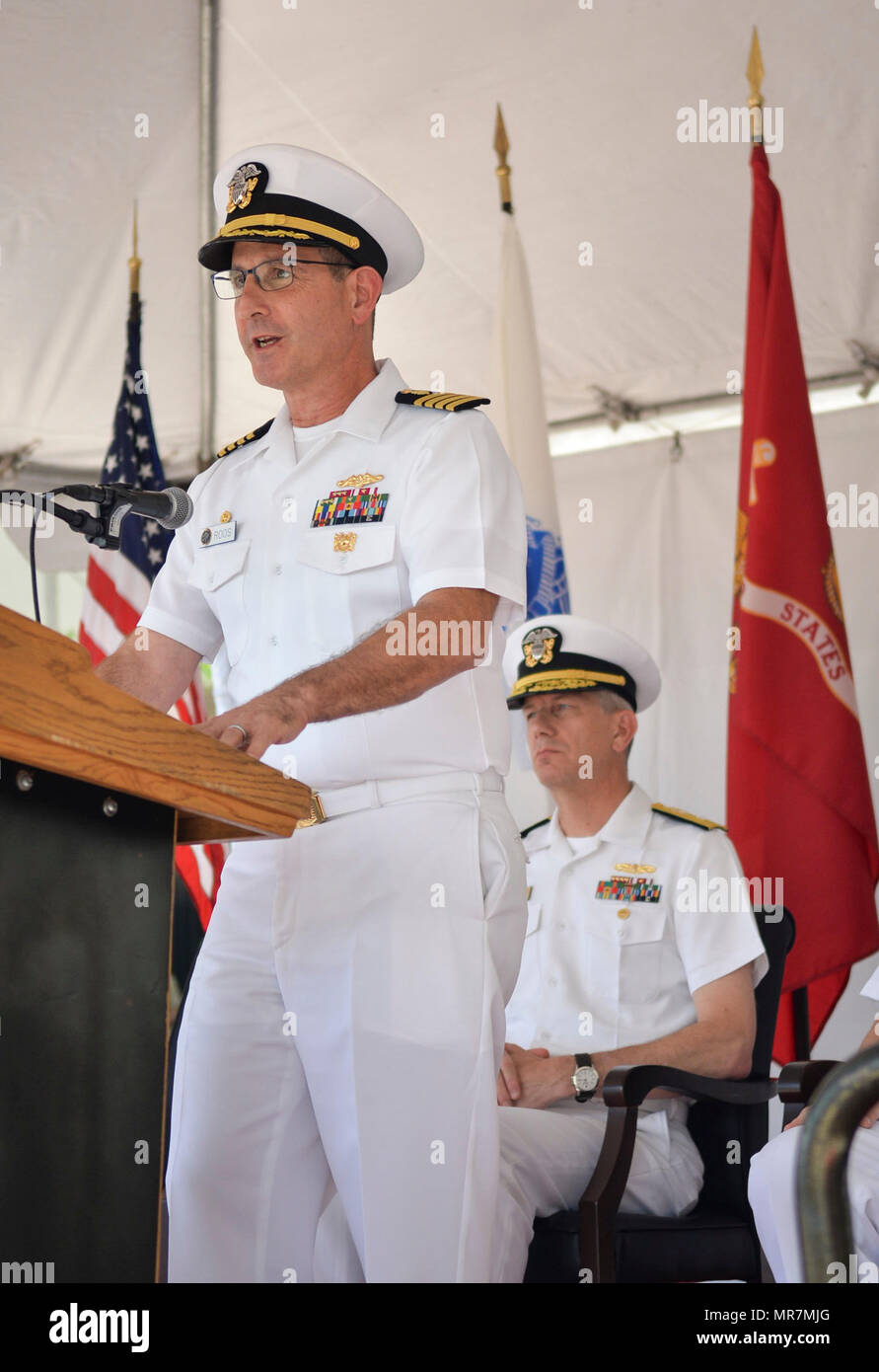 170517-N-IW246-097 SAN DIEGO (May 19, 2017) Commanding Officer Naval Medical Center San Diego (NMCSD), Capt. Joel A. Roos, introduces guest speaker Rear Adm. Paul D. Pearigen, Commander, Navy Medicine West and chief of the Navy Medical Corps, during NMCSD’s centennial ceremony. The ceremony was held to celebrate NMCSD’s 100th birthday. The Navy’s first permanent medical facility in San Diego was established in Balboa Park on May 20, 1917. (Photos by Culinary Specialist Petty Officer 2nd Class Luther C. Smith Jr./Released) Stock Photo