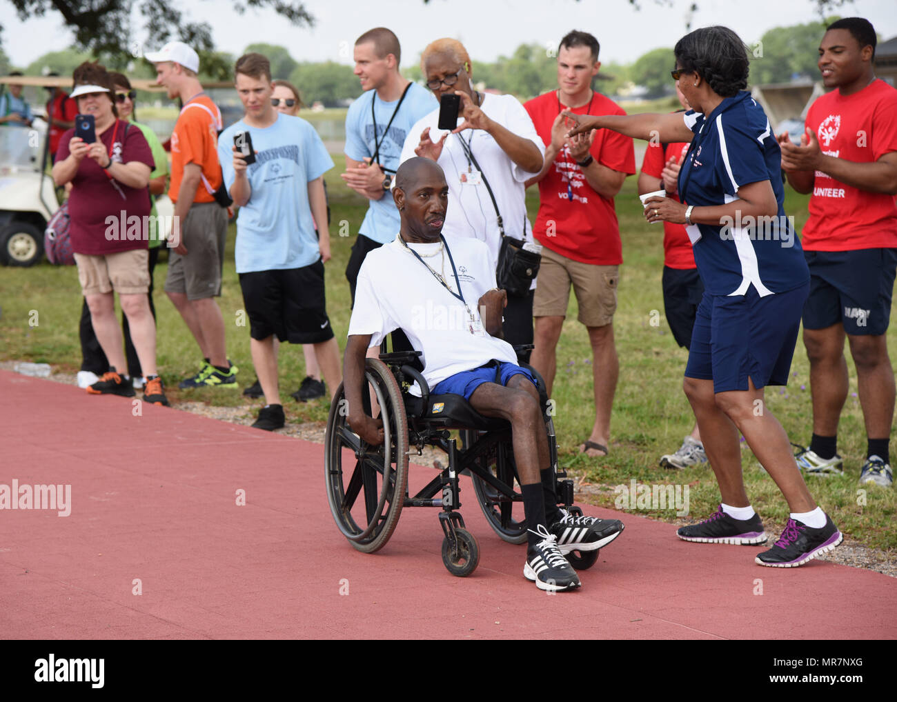 Special olympics athlete in wheelchair hires stock photography and