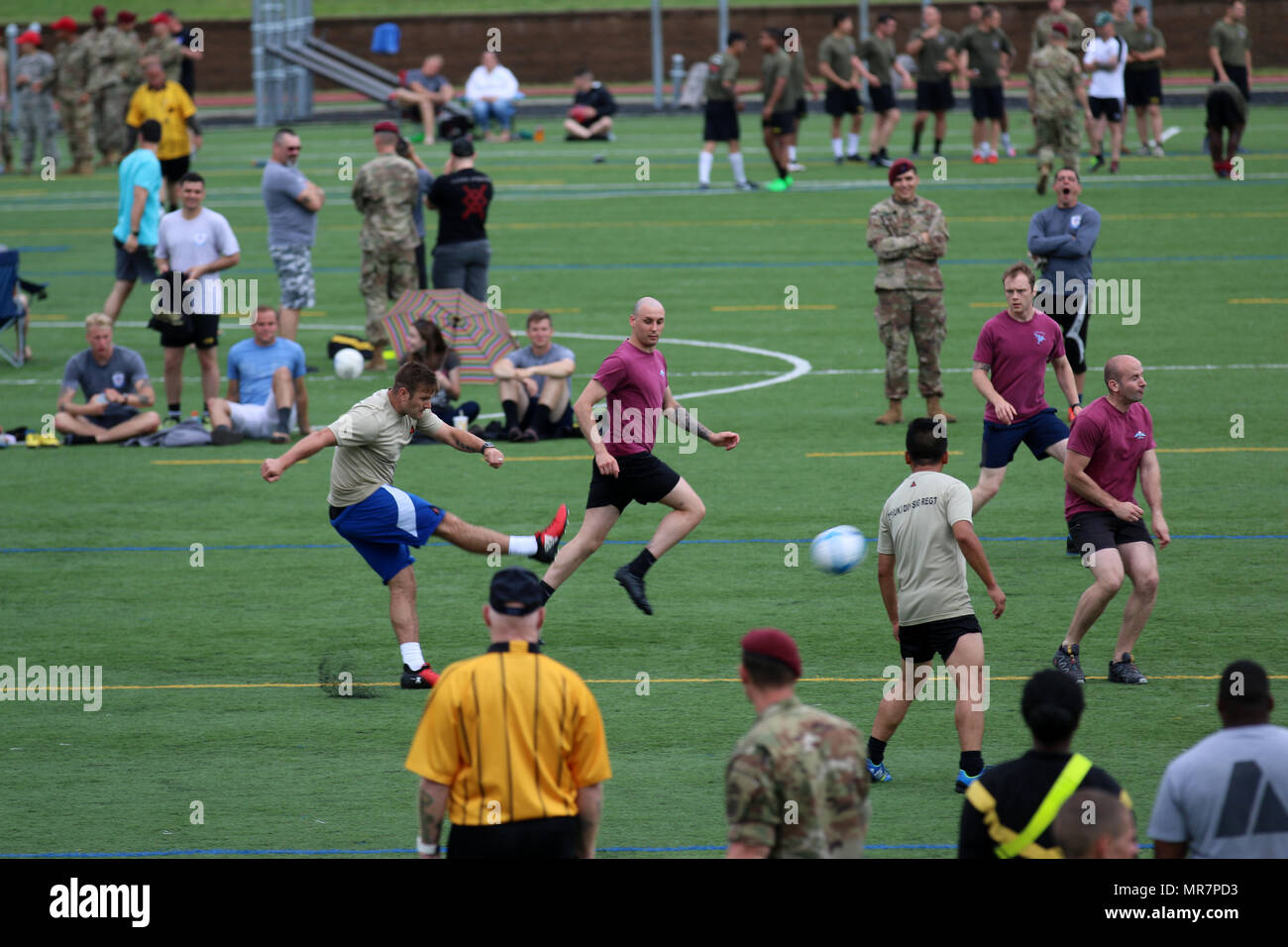 A British Paratrooper assigned to the 3rd (United Kingdom) Division’s Signal Regiment takes a shot at goal during an All American Week 100 soccer match at Towle Stadium, Fort Bragg, N.C., May 23, 2017. During All American Week 100, Paratroopers from throughout the Division competed in softball, soccer, flag football, tug-of-war, combatives, boxing, a best squad competition, a combat fitness test and the Little Group of Paratroopers competition for bragging rights and a shot at “Best Battalion.” All American Week is an opportunity for Paratroopers, past and present, to come together and celebra Stock Photo