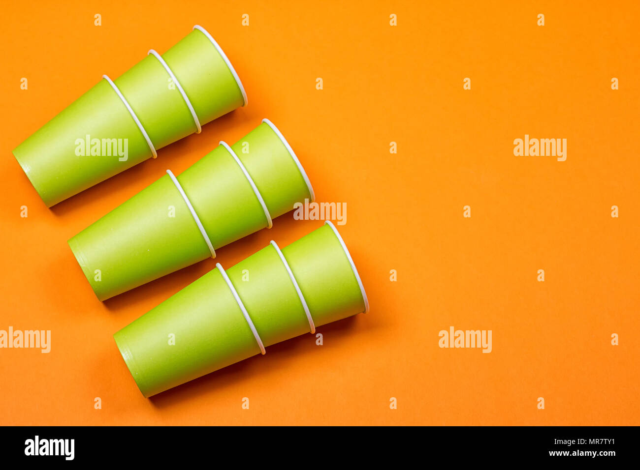 recycling colorful paper glass on the orange background Stock Photo - Alamy
