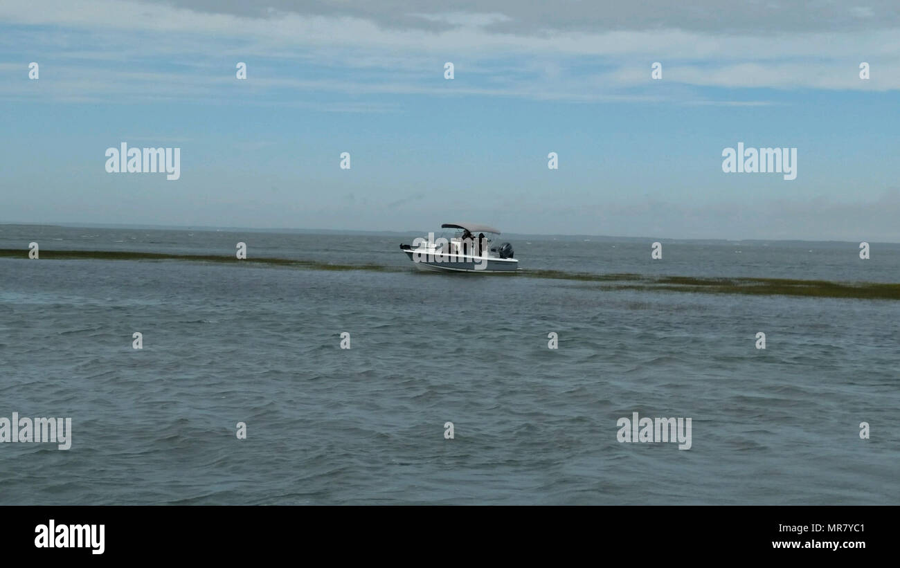 A recreational fishing boat is aground near Wachapreague, Va., May 25