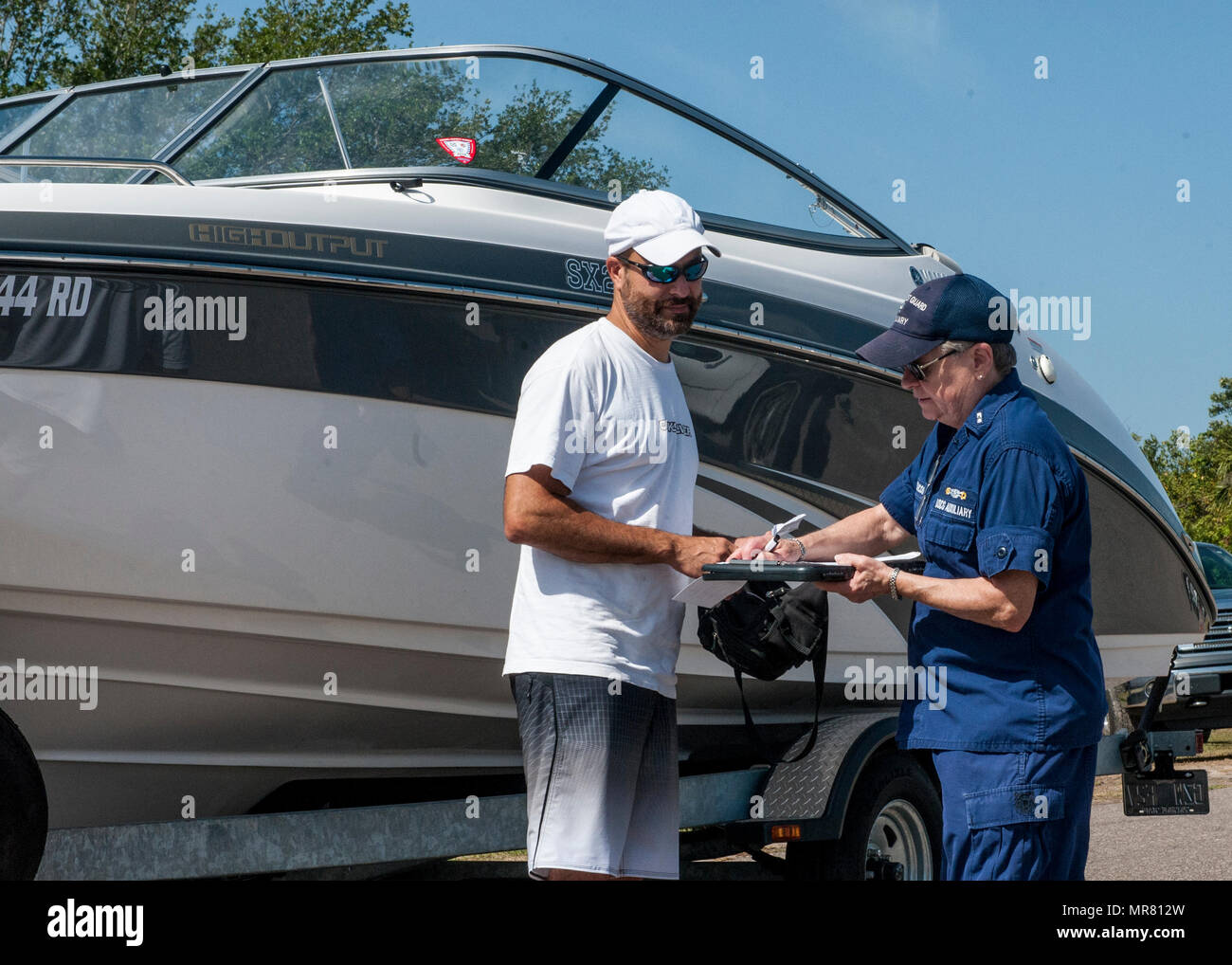 A member of Coast Guard Auxiliary Flotilla 79 conducts a free vessel