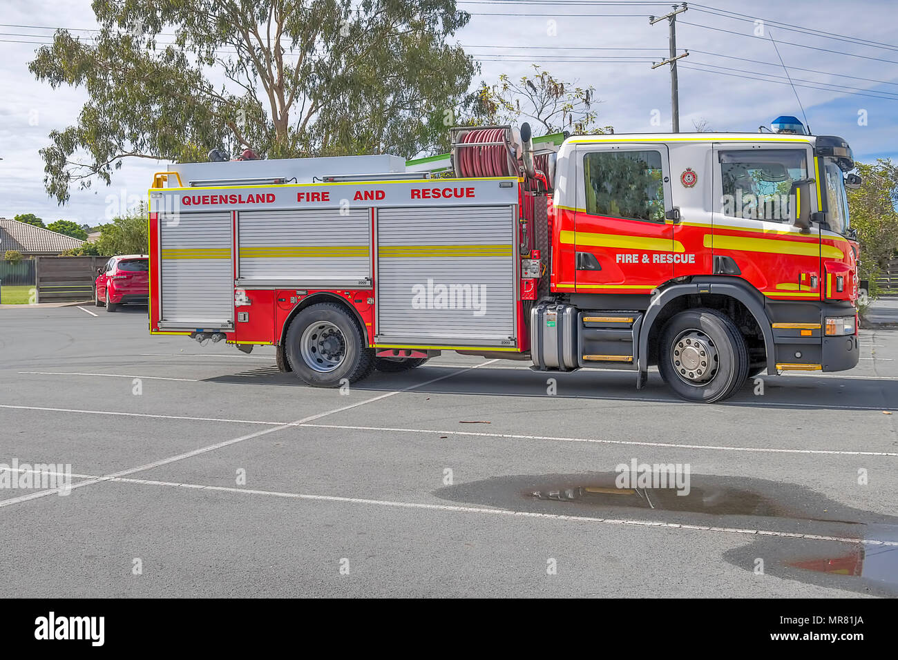 Fire and rescue truck stopped in car park Stock Photo