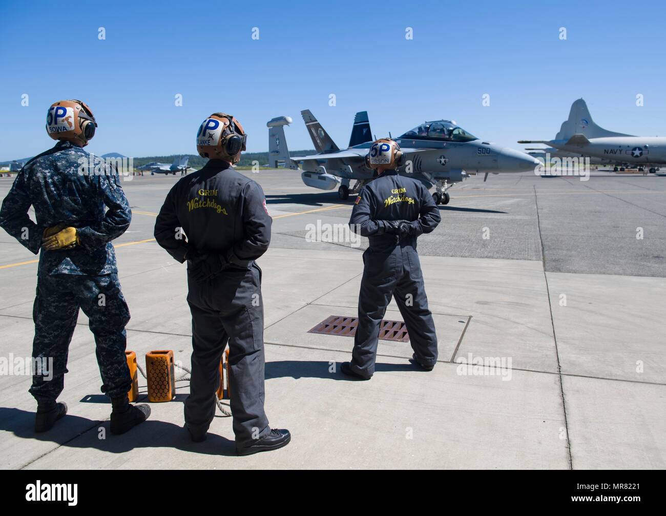 170526NKH214082 OAK HARBOR, Wash. (May 26, 2017) Sailors standby as