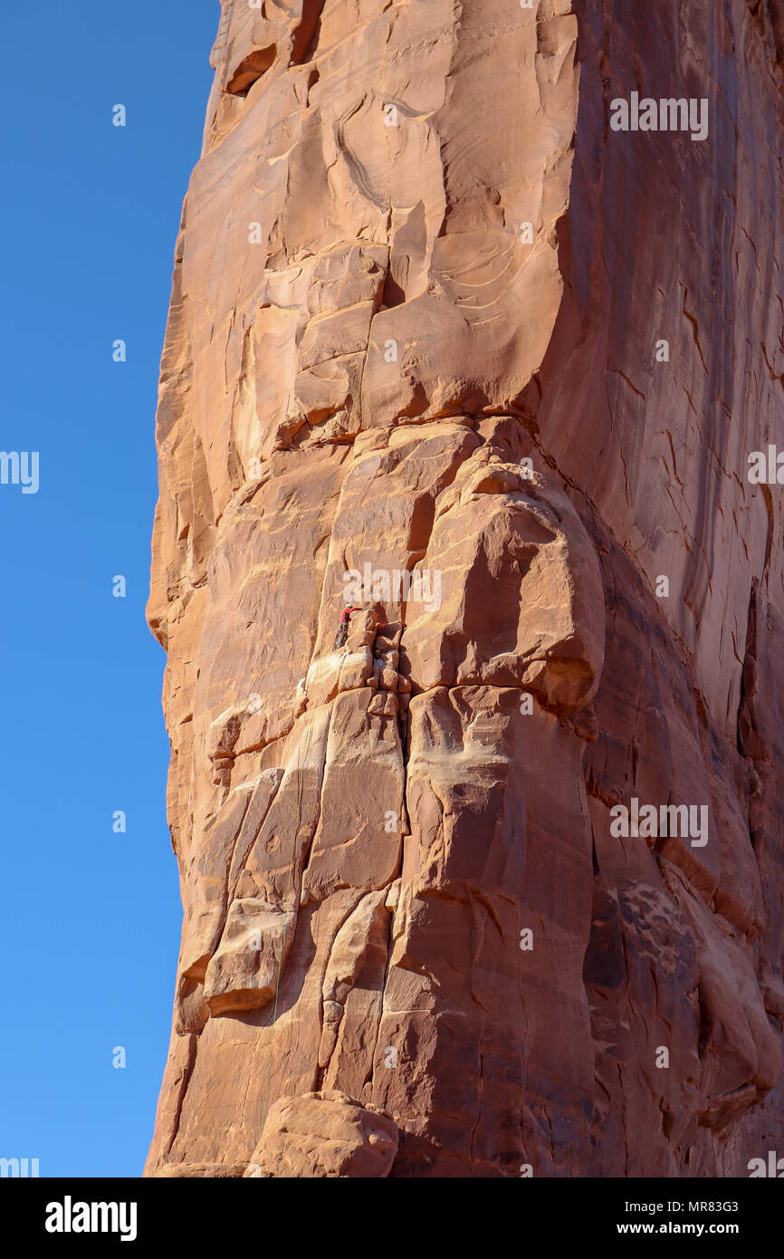 Rock climber on the Tower of Babel in the Arches National Park Utah Stock Photo