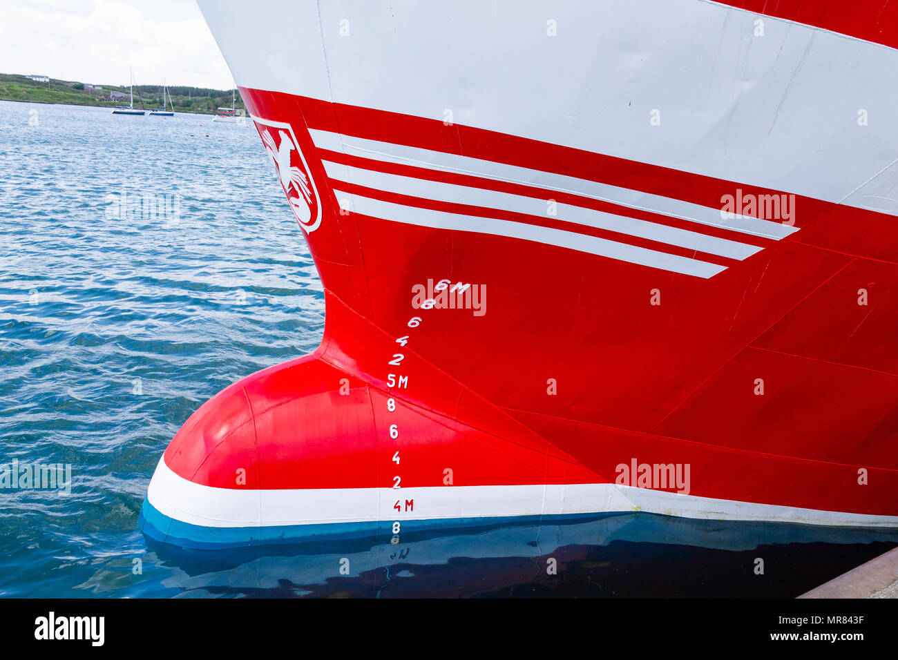 bulbous bow of a freshly painted trawler showing the draft or draught marks on the ships hull. Stock Photo