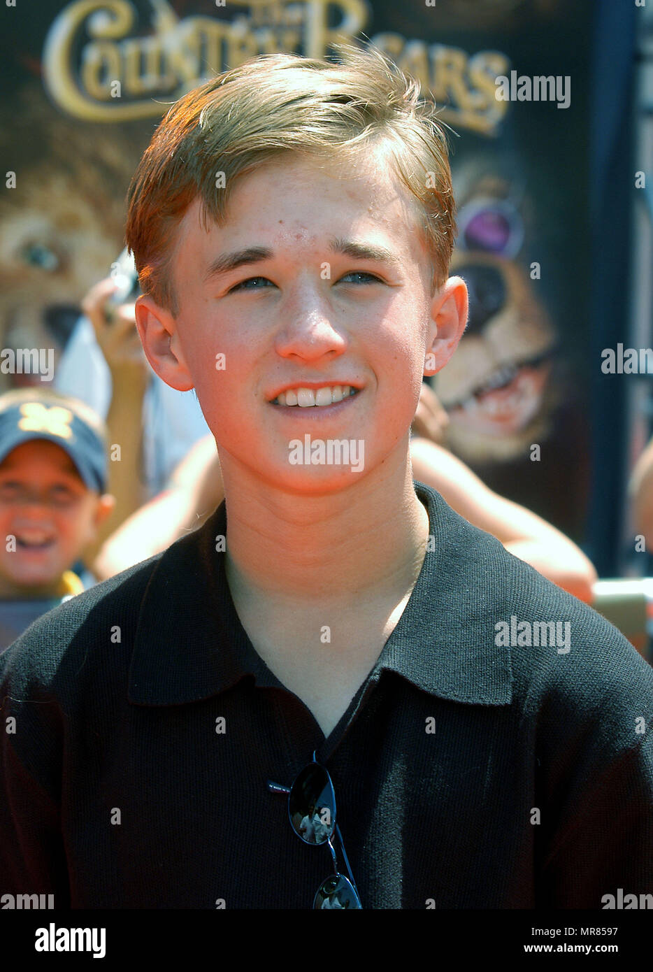 Haley Joel Osment arriving at the premiere of " Country Bears " at El