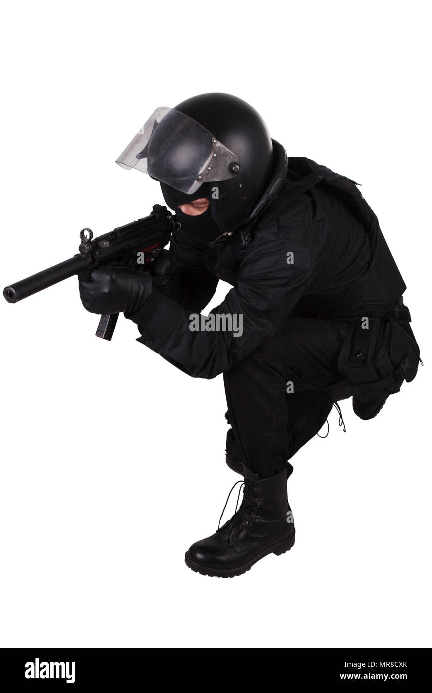 police special forces officer with submachine gun in black uniform isolated on white Stock Photo