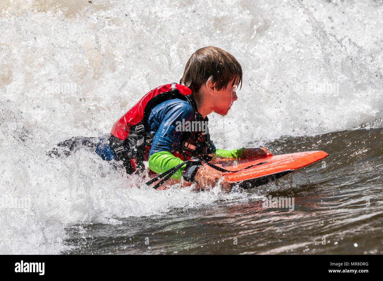 Children paddleboarding; Arkansas River; Salida; Colorado; USA Stock Photo