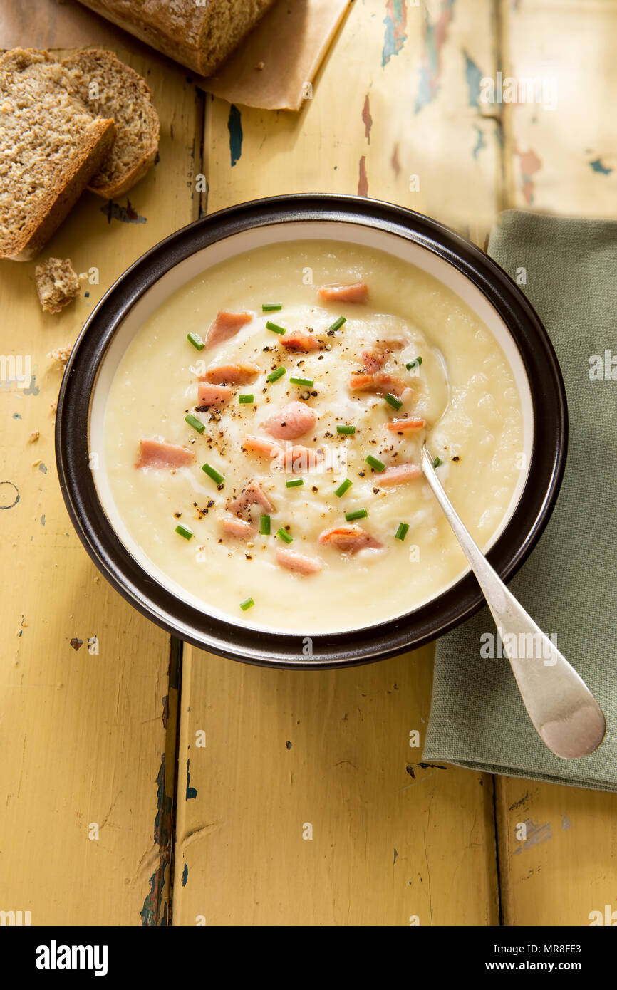 Celery root cream soup with bacon and cream Stock Photo