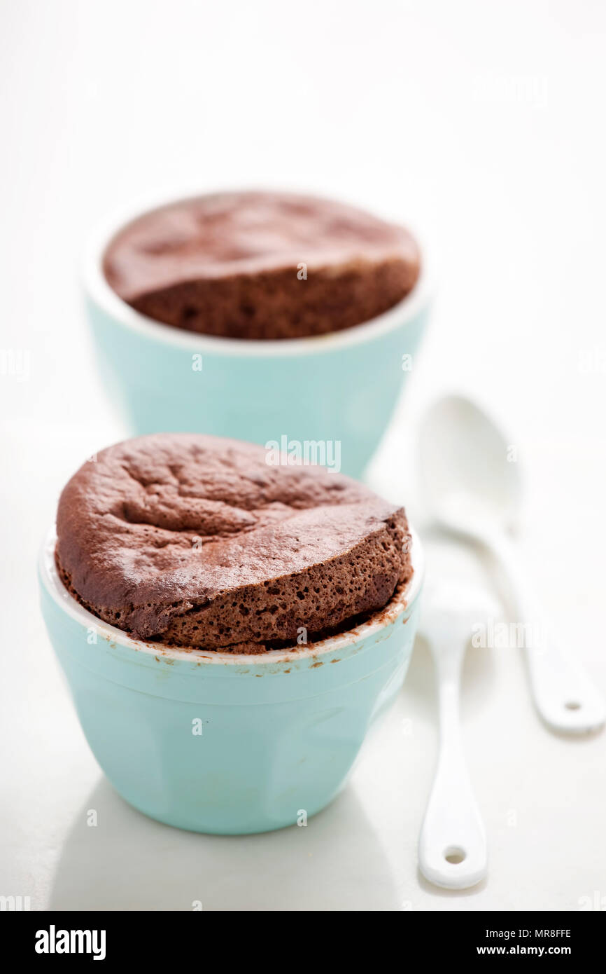 Chocolate souffles in ramekins Stock Photo Alamy