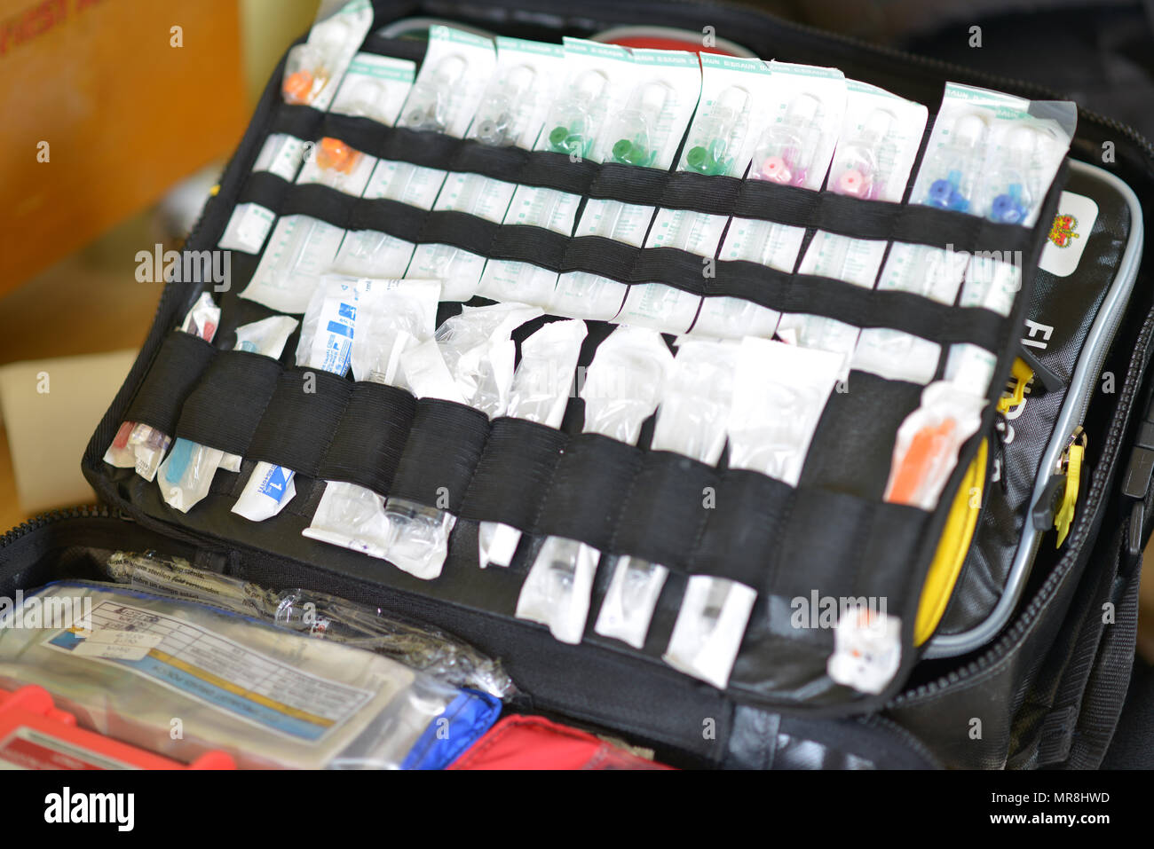 Paramedic's drug administration pack of catheters, needles and syringes. Stock Photo