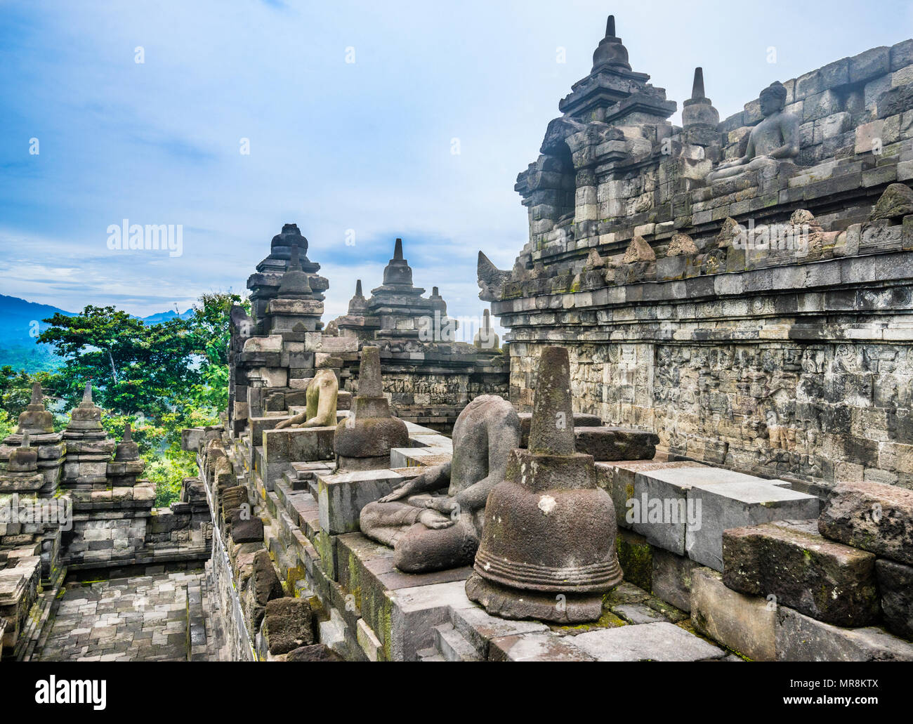 sitting Buddha statues on an outer balustrades of the 9th century Borobudur Buddhist temple, Central Java, Indonesia Stock Photo
