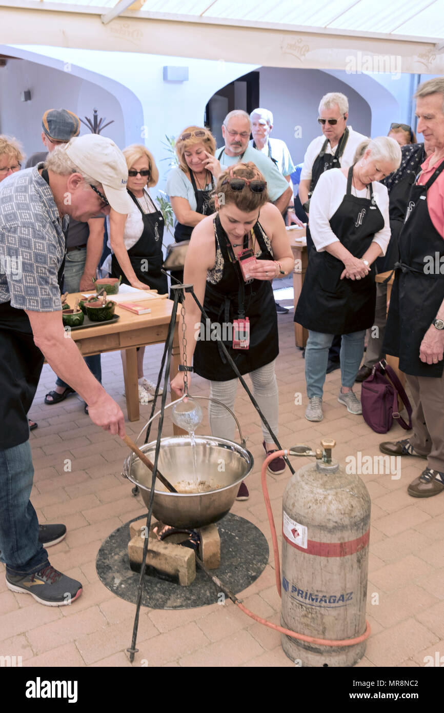 A Viking tour group get a lesson in Goulash soup making outside of Budapest Hungary. Stock Photo