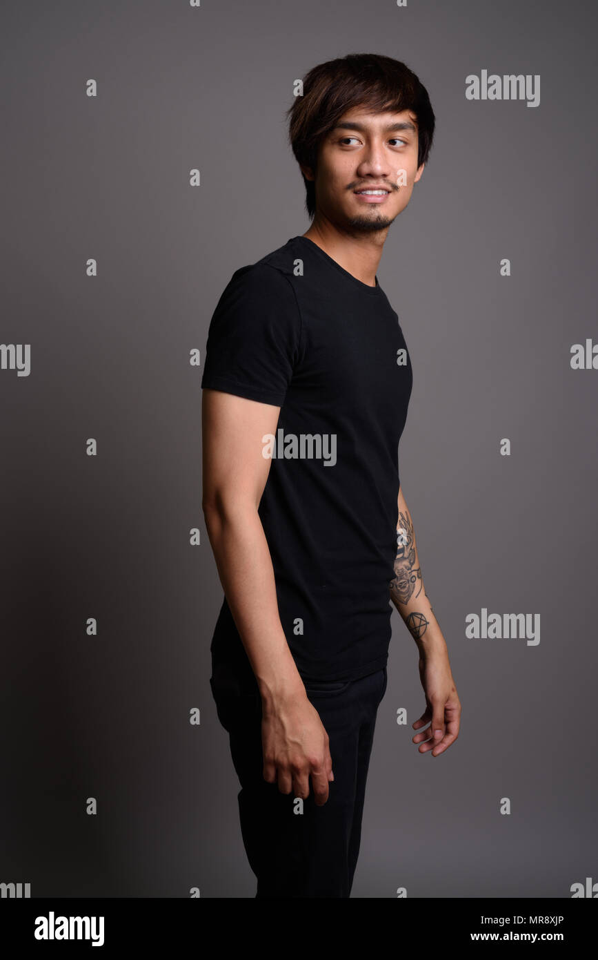 Young asian smiling man hi-res stock photography and images - Alamy