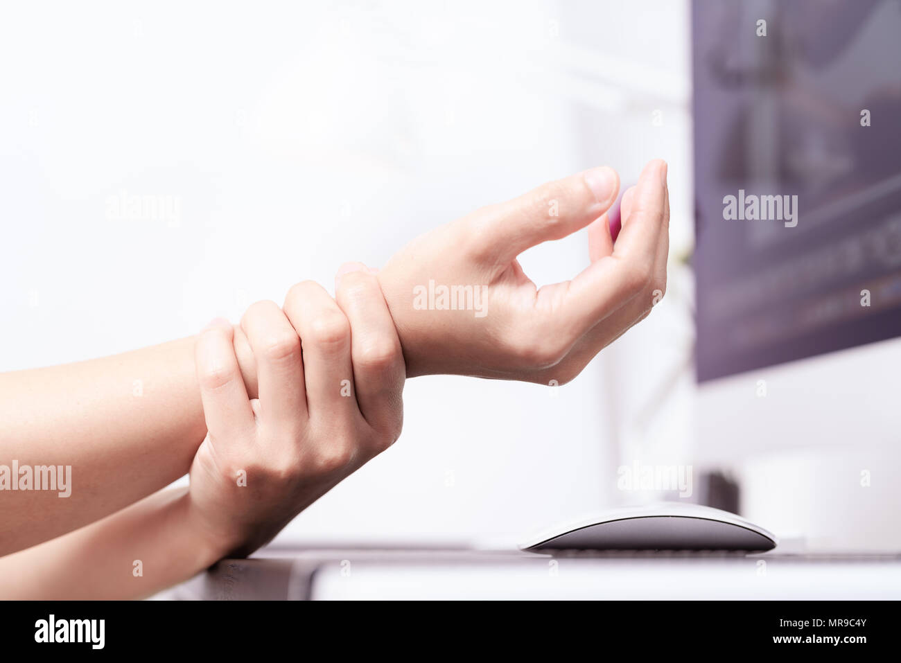 woman wrist arm pain long use mouse at office. office syndrome