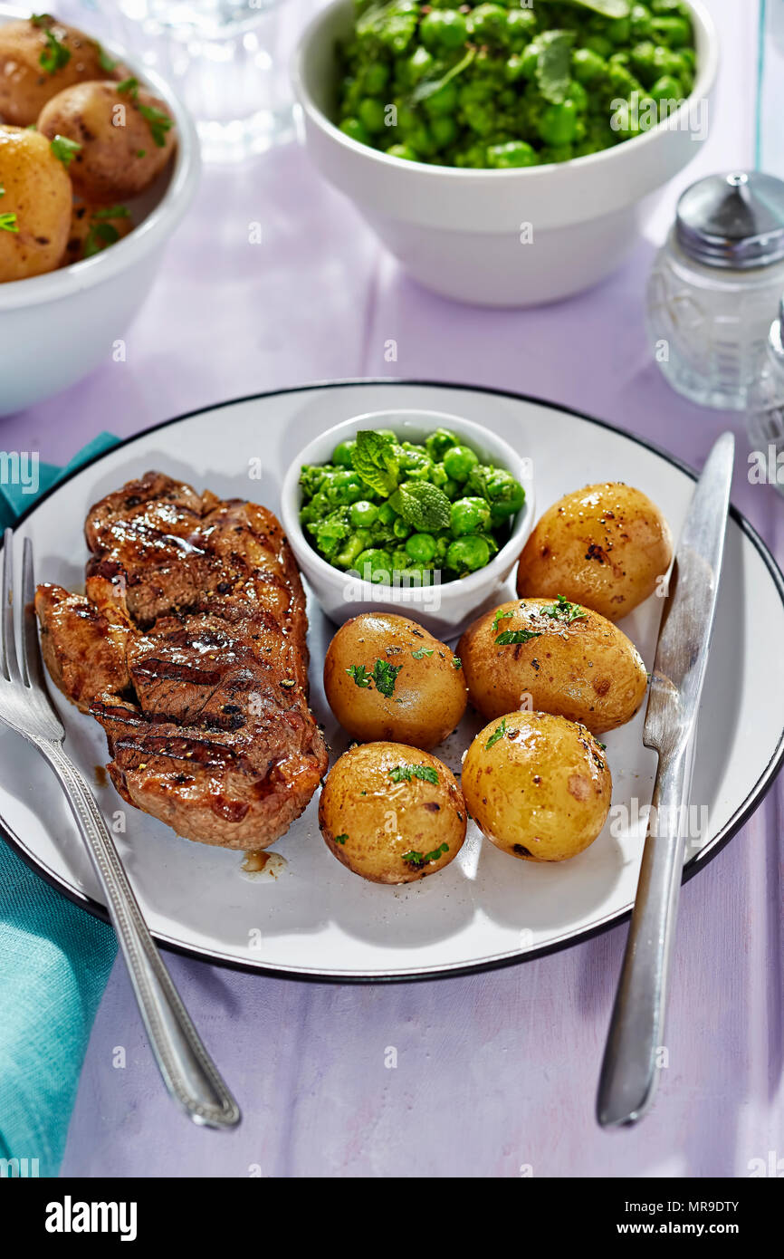 Lamb chops with baby potatoes and pea puree Stock Photo Alamy