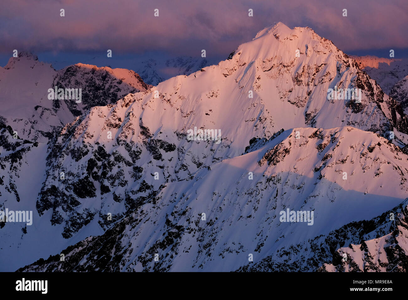 Sunset light on Eagle Peak in the Chugach Mountains of Alaska Stock