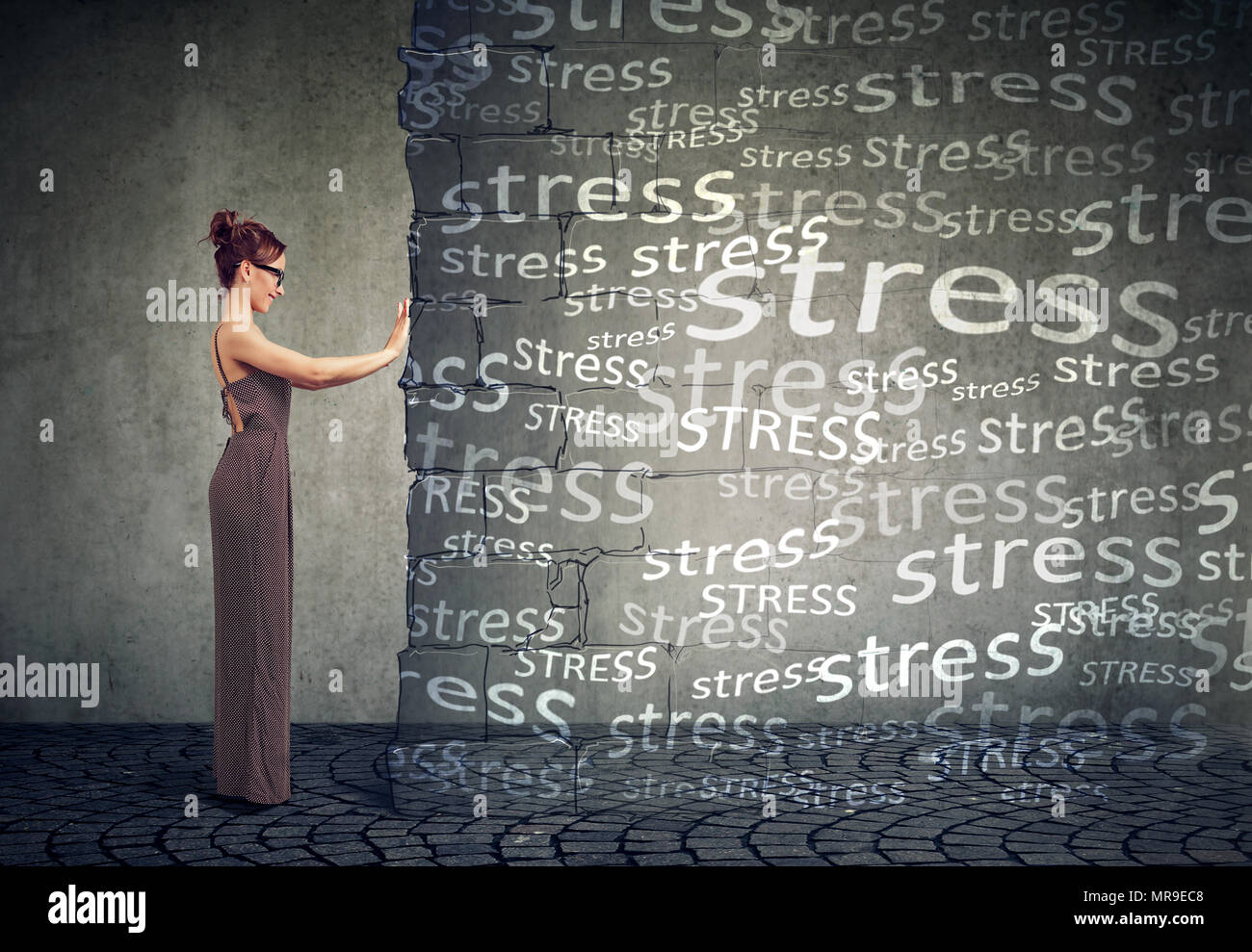 Side view of girl pushing away block wall with stress willing to have happy life. Stock Photo