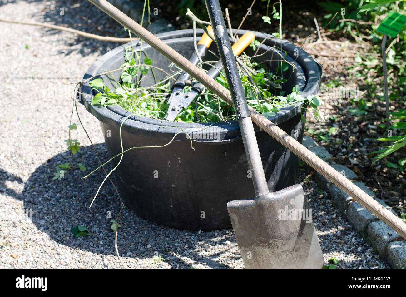 Garden equipment bucket, secateurs, rake and shovel Stock Photo Alamy
