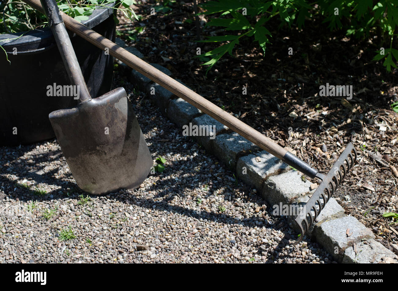 Garden equipment bucket, rake and shovel Stock Photo Alamy