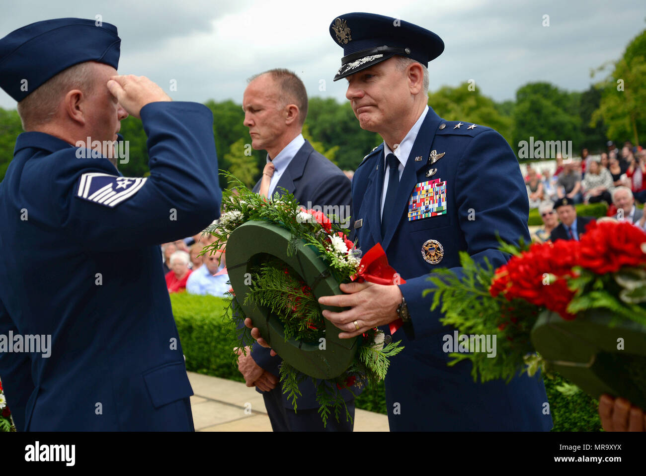 U.S. Air Force Maj. Gen. Timothy G. Fay, Headquarters U.S. Air Forces in Europe and Air Forces Africa director, operations, strategic deterrence and nuclear integration, accepts a wreath to lay at the Wall of the Missing at Madingley Memorial Cemetery on May 29, 2017, in Cambridge, England. The event is held annually and includes full military honors to remember all fallen heroes. (U.S. Air Force photo by Senior Airman Christine Groening) Stock Photo