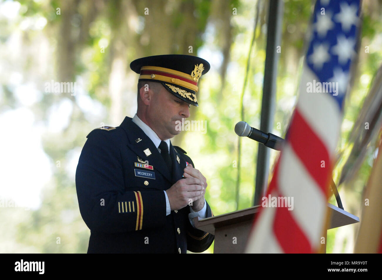 Lt. Col. Chris McCreery, commander of the 87th Combat Sustainment Support Battalion, 3rd Infantry Division Sustainment Brigade, pauses during a speech at the Richmond Hill, Ga., Memorial Day Observance at J.F. Gregory Park in Richmond Hill, May 29. During his speech, Mcreery spoke about a group of Soldiers he’d known who were killed in an IED attack while serving in Iraq. (U.S. Army photo by Sgt. 1st Class Ben K. Navratil) Stock Photo