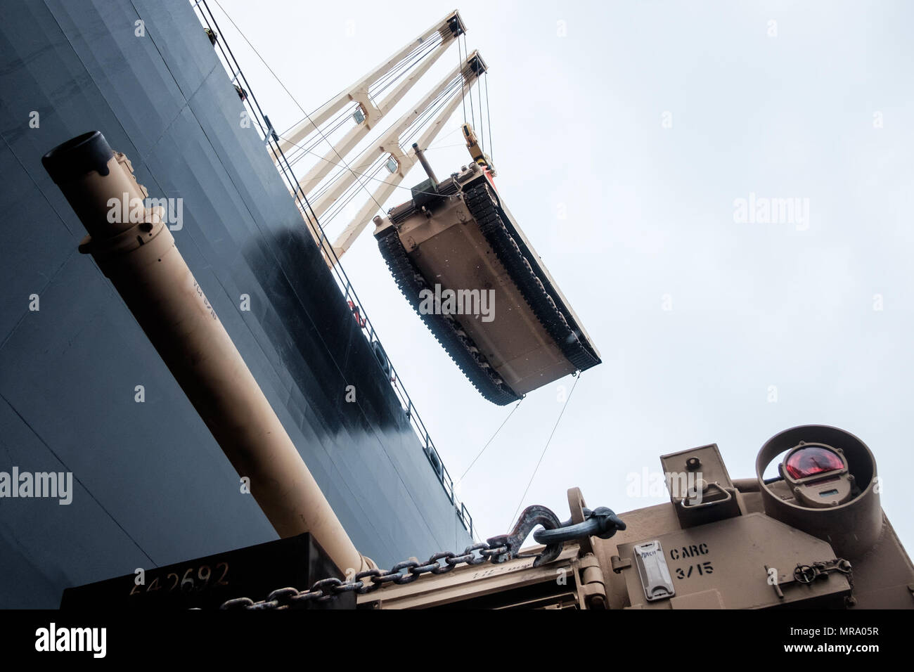 An M1A1 Abrams tank is transferred from the USNS SGT William R. Button ...