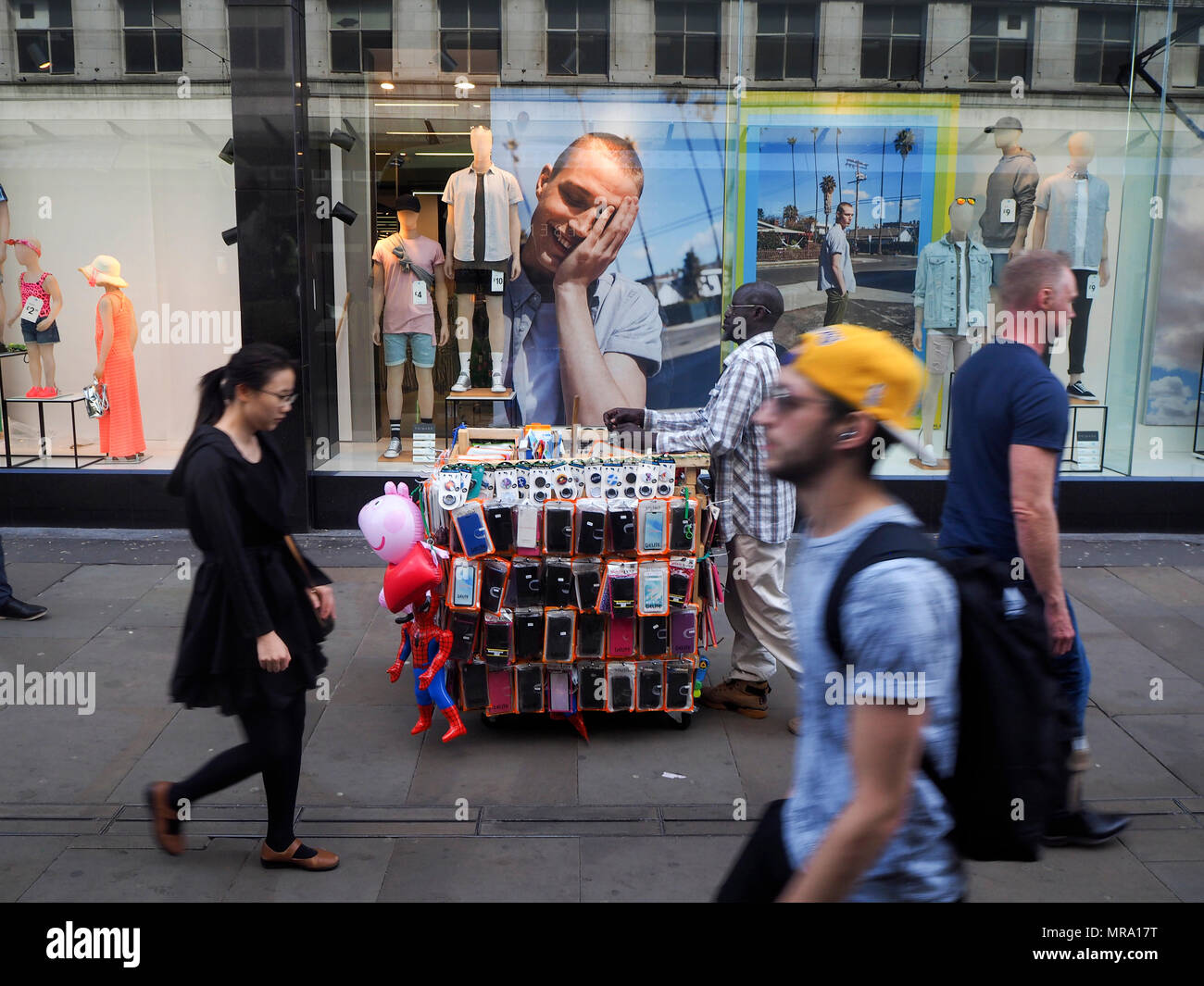Street trader with portable stall Stock Photo