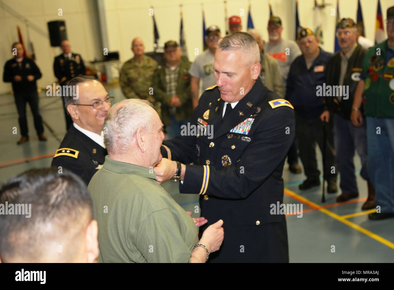 Fort McCoy Garrison Commander Col. David J. Pinter Sr. places a Vietnam Veterans Lapel Pin on retired Command Sgt. Maj. Kenneth Stumpf, a Medal of Honor recipient, during the Vietnam Veterans Welcome Home Ceremony on May 20, 2017, at Fort McCoy, Wis. Each veteran attending the ceremony received a Vietnam Veterans Lapel Pin. The ceremony was one of many taking place around the United States that officially recognizes veterans who served between May 1, 1955, and Nov. 15, 1975. The ceremony also was held in conjunction with the 2017 Fort McCoy Armed Forces Day Open House. (U.S. Army Photo by Scot Stock Photo
