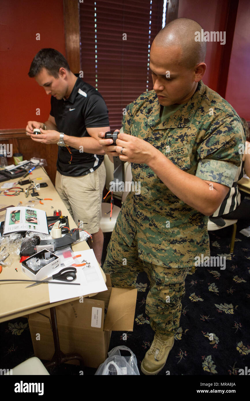 U.S. Marines and civilian contractors with II Marine Expeditionary