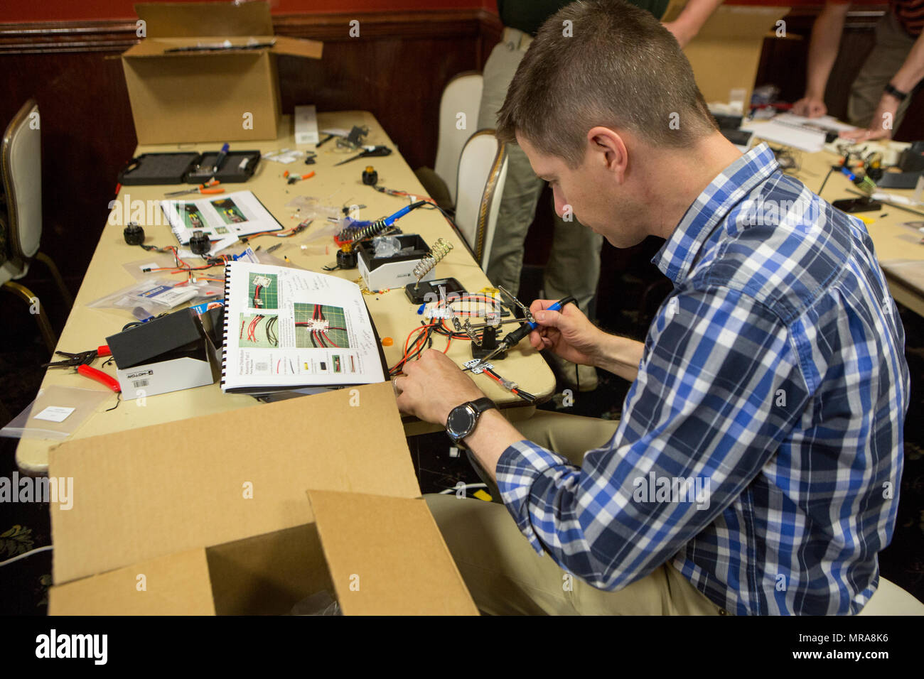 U.S. Marines and civilian contractors with II Marine Expeditionary