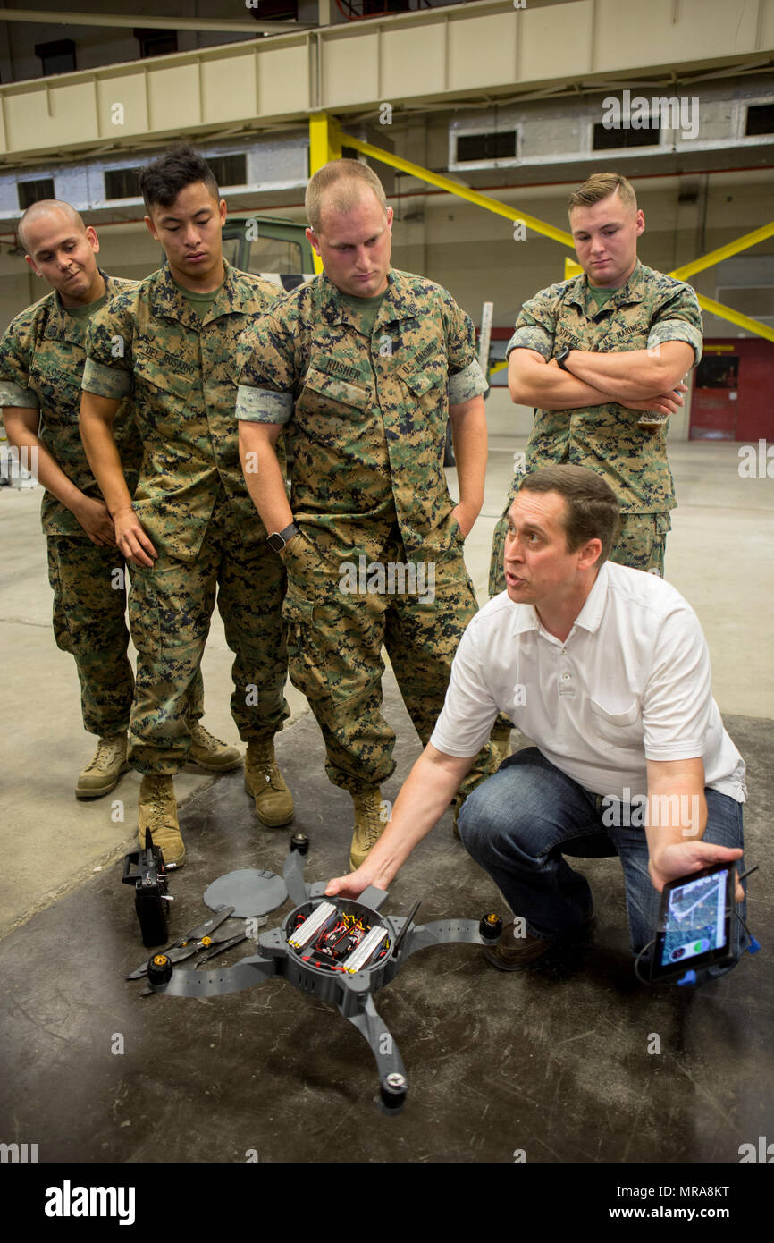 U.S. Marines and civilian contractors with II Marine Expeditionary