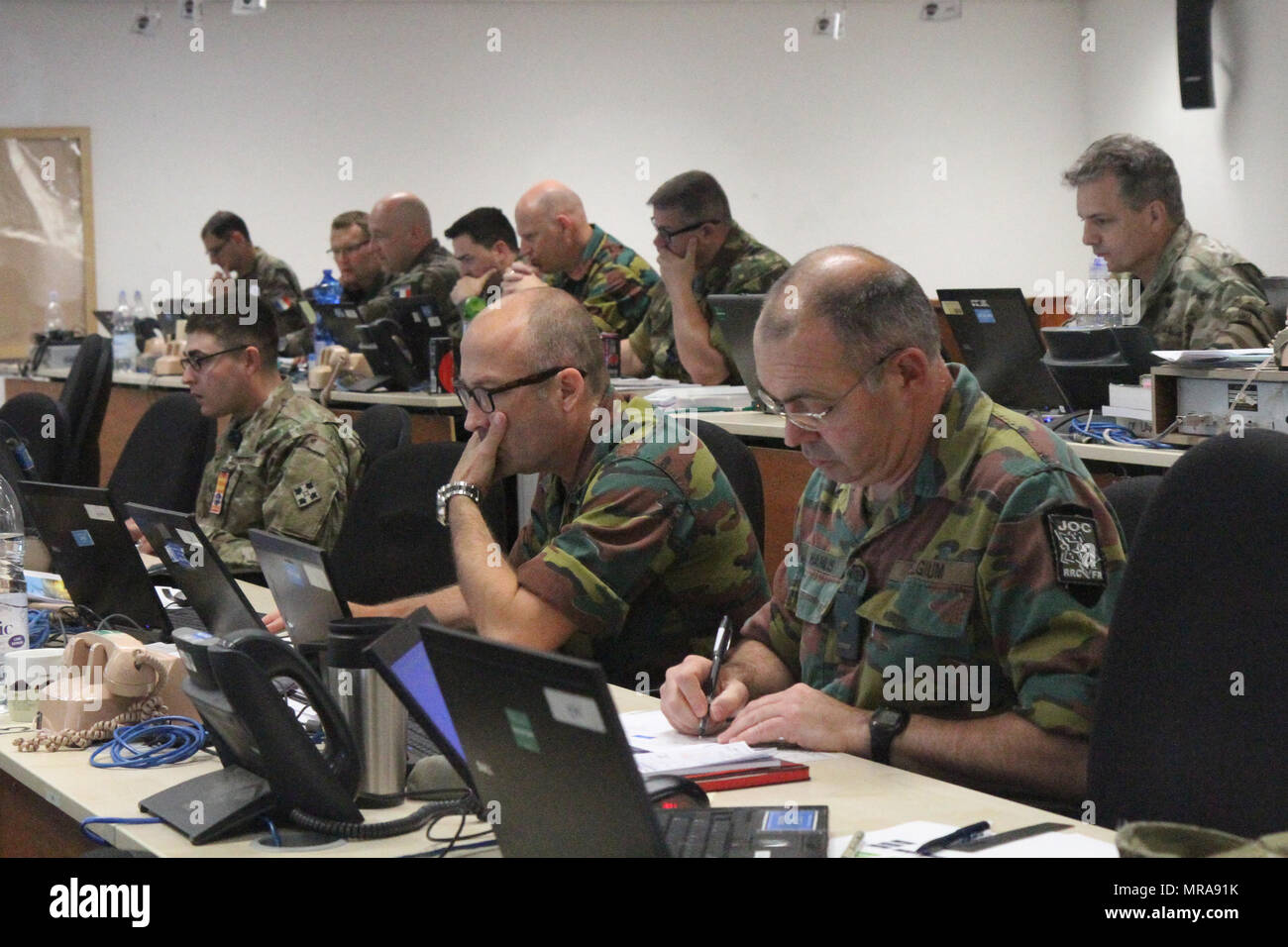 Members of the Rapid Reaction Corps – France perform their daily duties in the Division Tactical Operations Center at Joint Multinational Readiness Center Hohenfels, Germany May 31, 2017.  RRC-France is a French headquarters with multinational officers and noncommissioned officers able to be employed in NATO, European Union, French or other operations by the French government to undertake combined and joint operations across the operational spectrum as a Corps or Land Component HQ and is serving as the higher headquarters during phase 3 of Combined Resolve VIII, which runs from May 24 to June  Stock Photo