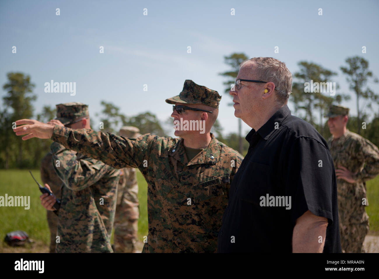 The Deputy Secretary of Defense, Honorable Mr. Robert O. Work, right, speaks with Lt. Col. Theodore Bethea, commanding officer of Advanced Infantry Training Battalion-East, School of Infantry- East, at Camp Lejeune, N.C., June 2, 2017. Marines from the School of Infantry demonstrated a live fire exercise as a part of training to diplomats and military personnel during their visit to the base.  (U.S. Marine Corps photo by Lance Cpl. Tyler Pender) Stock Photo