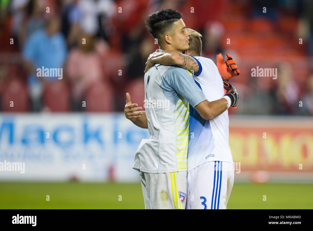 Toronto, Canada. 25th May, 2018. Goalkeeper Jesse Gonzalez (L) of FC Dallas celebrates victory with teammate Reto Ziegler after the 2018 Major League Soccer (MLS) match between Toronto FC and FC Dallas at BMO Field in Toronto, Canada, May 25, 2018. Toronto FC lost 0-1. Credit: Zou Zheng/Xinhua/Alamy Live News Stock Photo