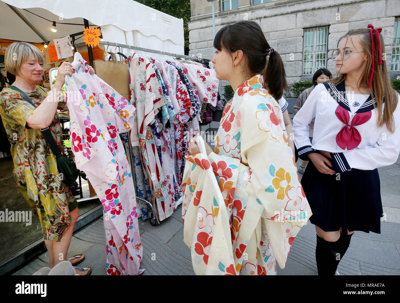 Duesseldorf, Germany, 26 May 2018, A woman tries on a kimono at the 17th Japan Day festivities. With its 7000 members, Duesseldorf's Japanese community is the third largest in Europe. Photo: Roland Weihrauch/dpa Stock Photo