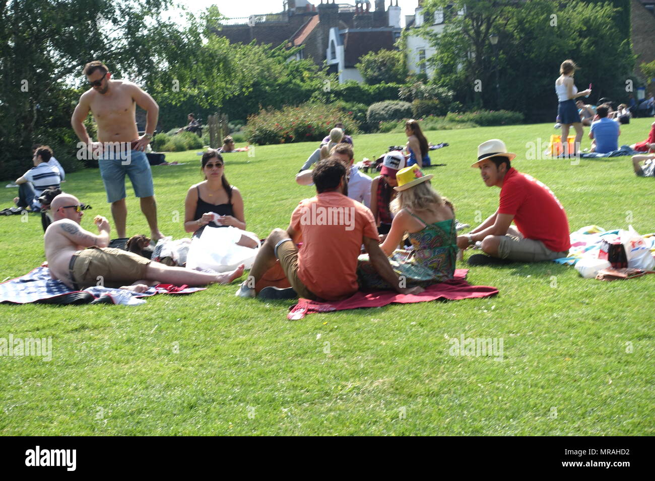 London, UK. 26th May 2018. UK Weather Friends enjoy the good weather