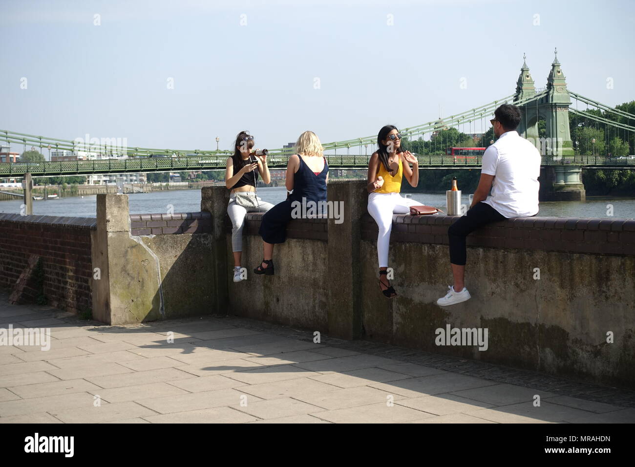 London, UK. 26th May 2018. UK Weather Friends enjoy the good weather