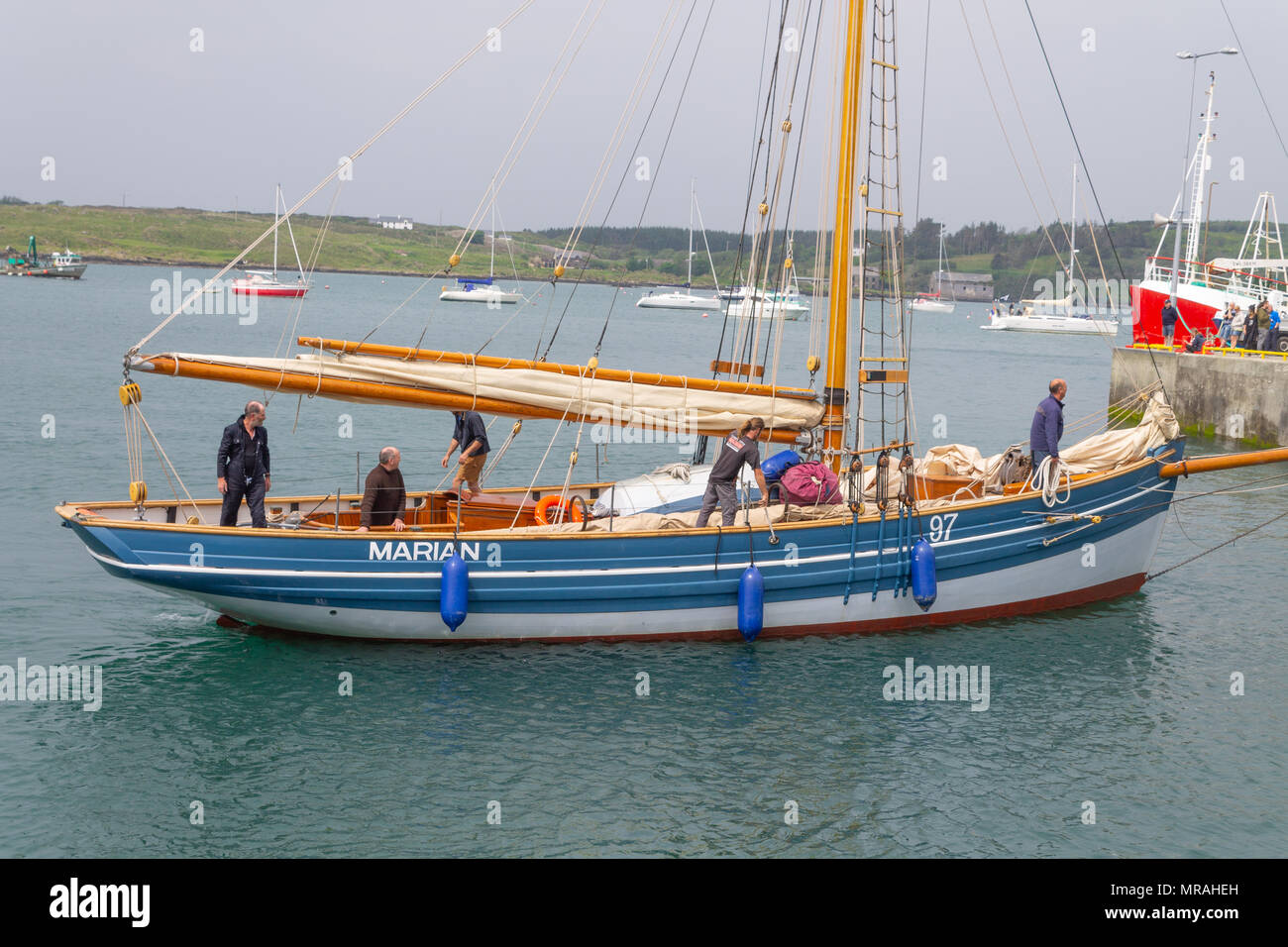 Baltimore, Ireland 26th May, 2018. Wooden boats of all shapes and sizes gather for the Wooden Boat Festival this weekend, with boats under sail racing, a boat building competition, a spectacular parade of sail boats, plus many other attractions, all in conjunction with the Baltimore Sea Food Festival. Credit: aphperspective/Alamy Live News Stock Photo