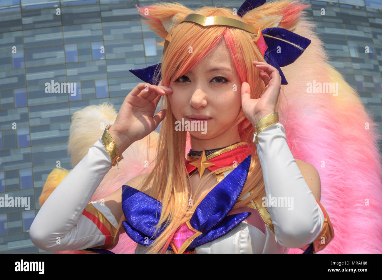ExCel, London, 26th May 2018. A female cosplayer poses as star guardian Ahri from League of Legends. Cosplayers, Comic Characters, superheros and costumed visitors come together for MCM Comicon 2018 on the second day, a busy Saturday, running at ExCel Exhibition Centre May 25-27th. Credit: Imageplotter News and Sports/Alamy Live News Stock Photo
