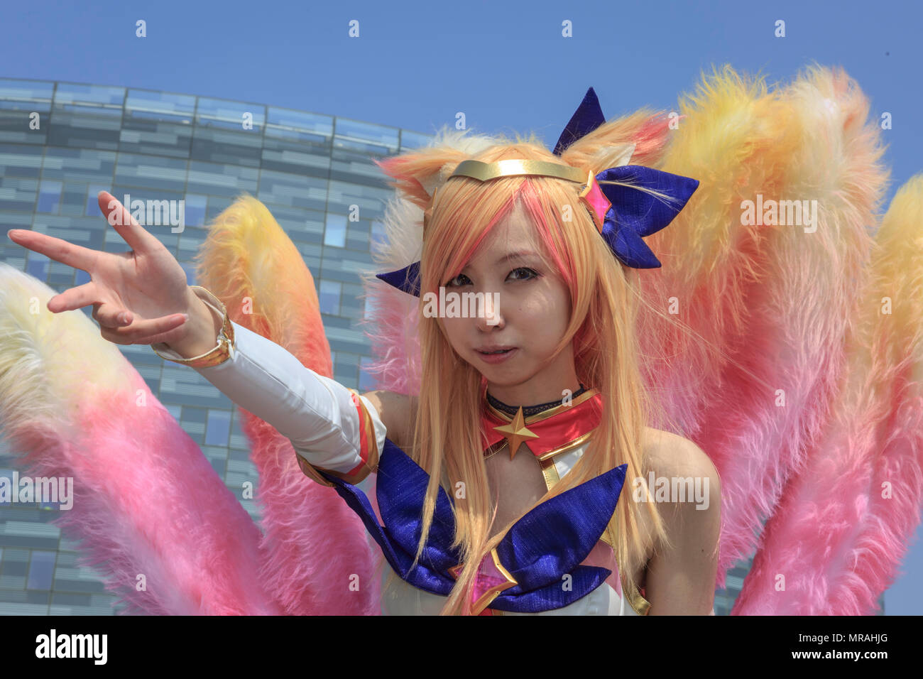 ExCel, London, 26th May 2018. A female cosplayer poses as star guardian Ahri from League of Legends. Cosplayers, Comic Characters, superheros and costumed visitors come together for MCM Comicon 2018 on the second day, a busy Saturday, running at ExCel Exhibition Centre May 25-27th. Credit: Imageplotter News and Sports/Alamy Live News Stock Photo