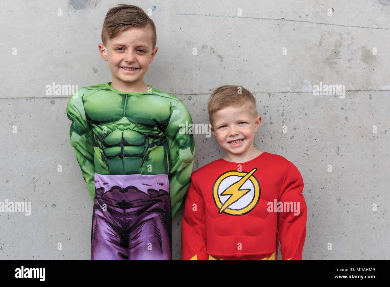 ExCel, London, 26th May 2018. Tommy (right) dressed as Flash, and Tyler  (left), dressed as Hulk, are at Comicon with their mum and are looking  forward to a day of fun. Cosplayers,