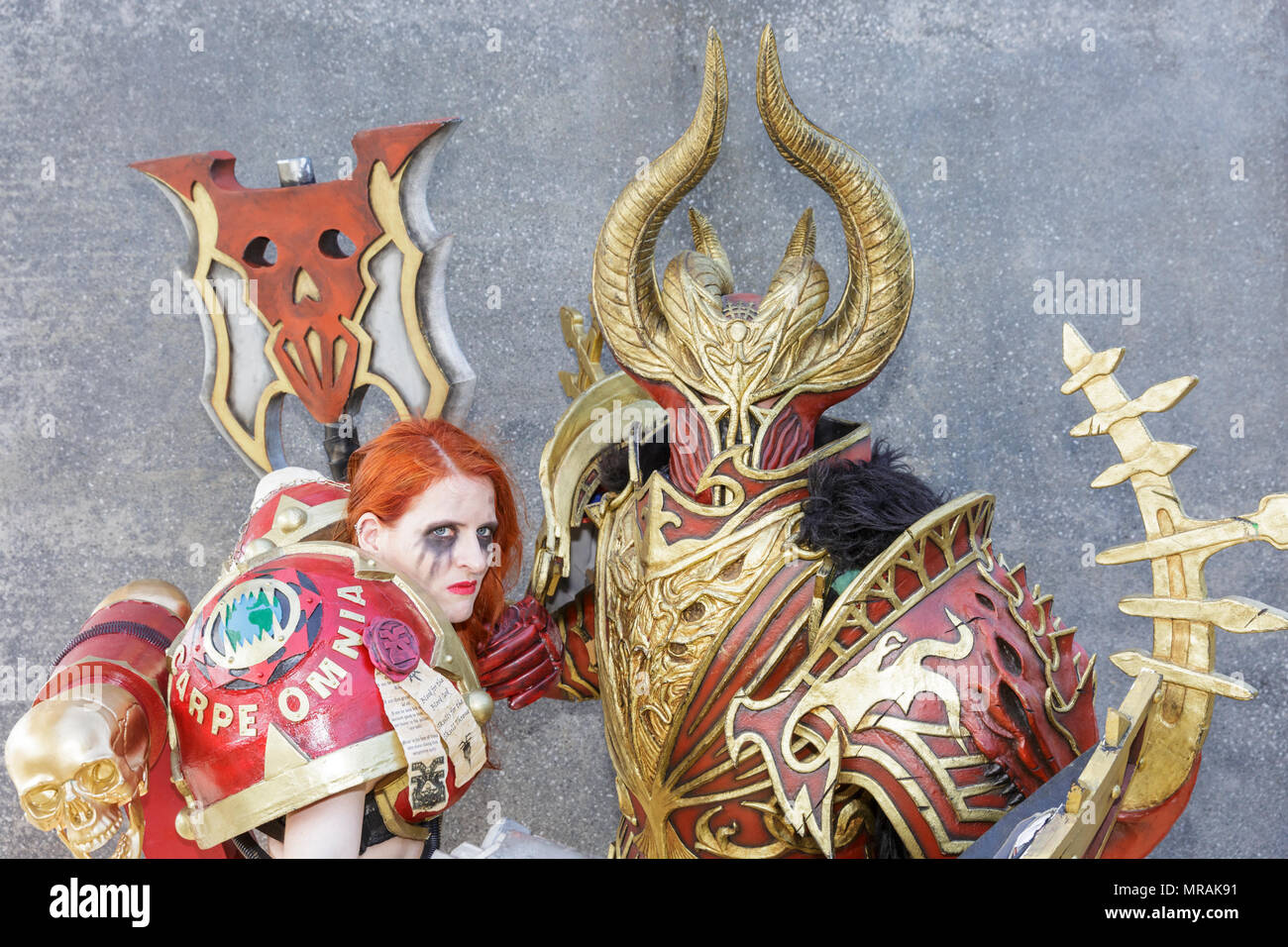 ExCel, London, 26th May 2018. Two concept art characters from Warhammer 40K pose in their elaborate outfits. Cosplayers, Comic Characters, superheros and costumed visitors come together for MCM Comicon 2018 on the second day, a busy Saturday, running at ExCel Exhibition Centre May 25-27th. Credit: Imageplotter News and Sports/Alamy Live News Stock Photo