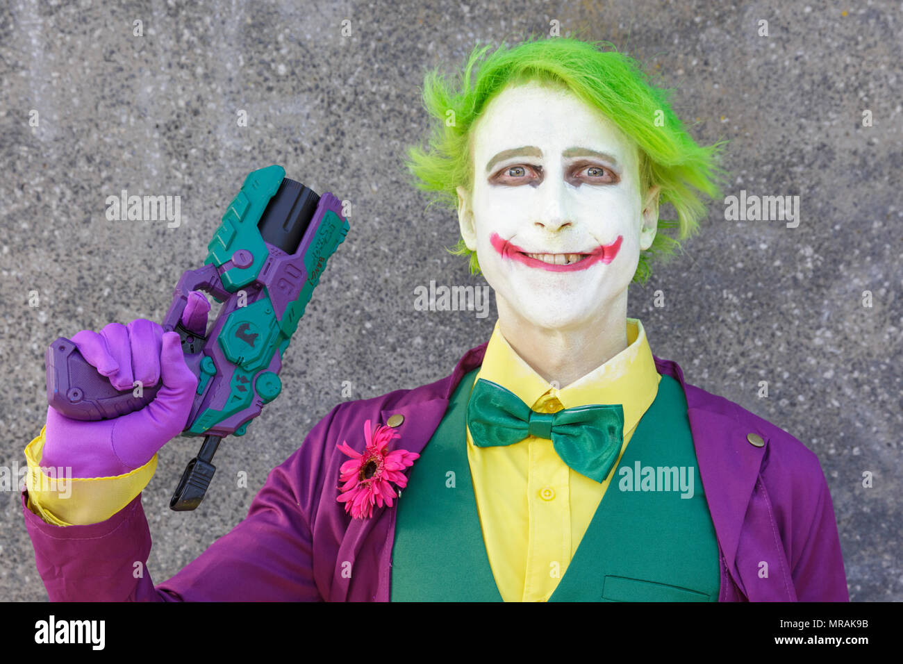 ExCel, London, 26th May 2018. The Joker from Batman Dark Knight Rises makes a his appearance with a bang! Cosplayers, Comic Characters, superheros and costumed visitors come together for MCM Comicon 2018 on the second day, a busy Saturday, running at ExCel Exhibition Centre May 25-27th. Credit: Imageplotter News and Sports/Alamy Live News Stock Photo