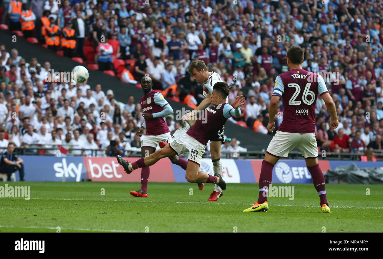 Kevin McDonald of Fulham gets a shot away under pressure from Jack Grealish of Aston Villa during the Sky Bet Championship Play-Off Final match between Aston Villa and Fulham at Wembley Stadium on May 26th 2018 in London, England. (Photo by Arron Gent/phcimages.com) Stock Photo