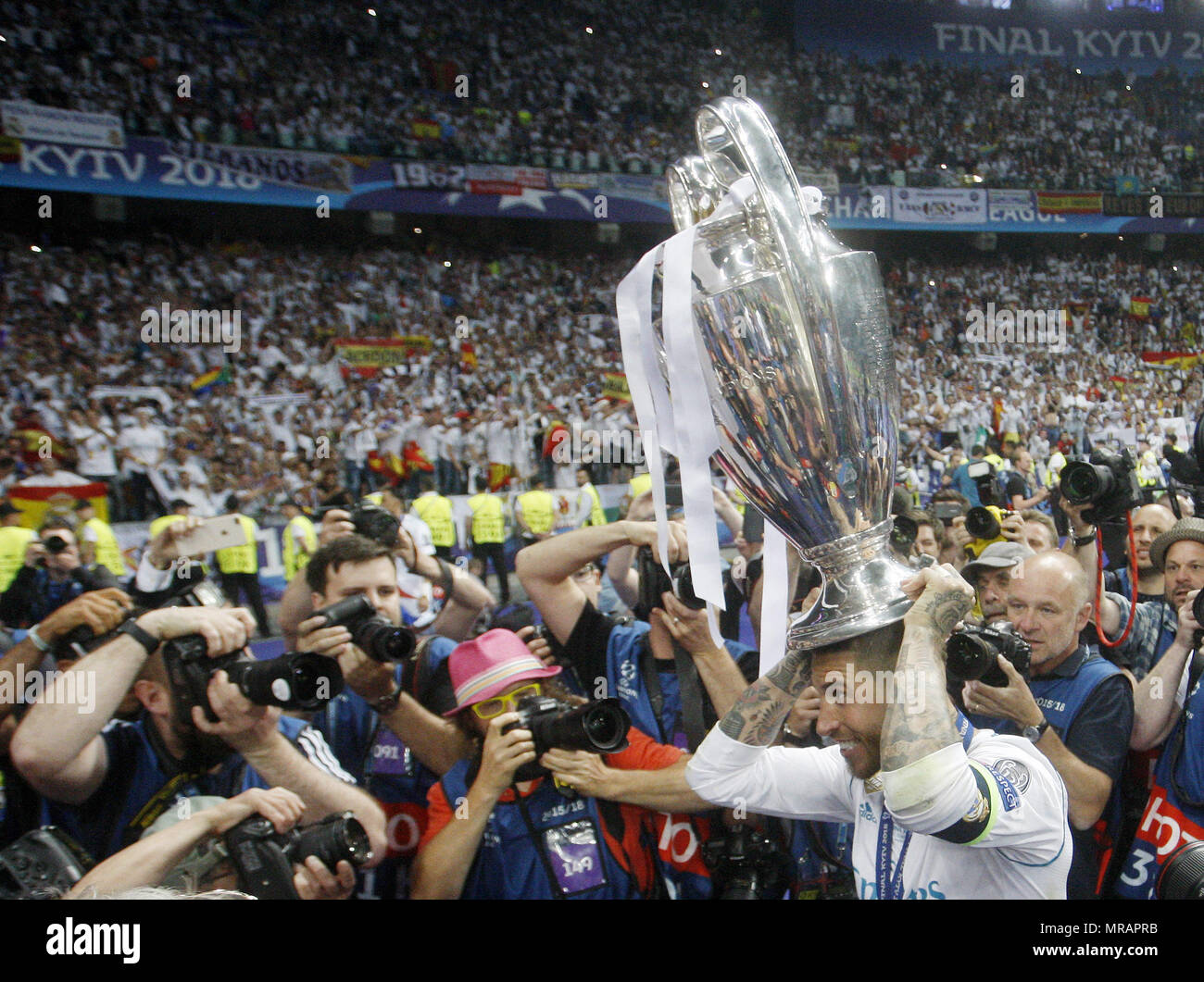 Kiev, Ukraine. 27th May, 2018. Real Madrid's SERGIO RAMOS celebrates with the trophy after winning the UEFA Champions League final soccer match Real Madrid vs Liverpool FC, at the NSC Olimpiyskiy stadium in Kiev on 26 May 2018. Credit: Serg Glovny/ZUMA Wire/Alamy Live News Stock Photo
